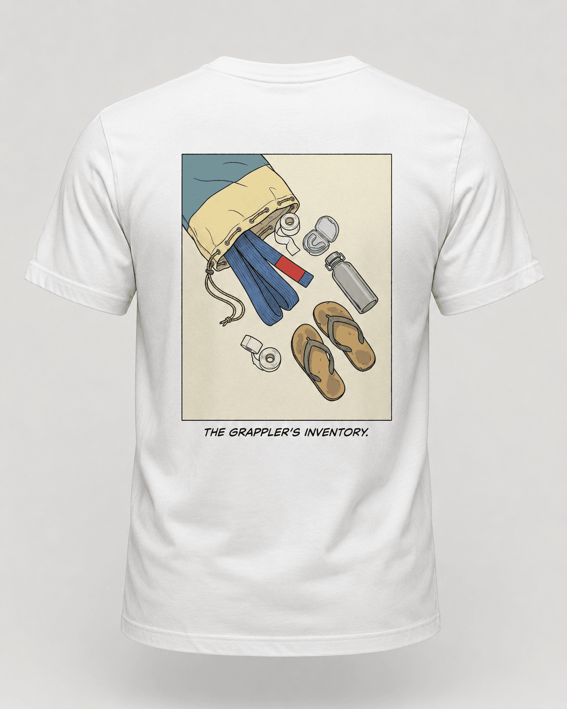 White tee with a comic panel of a gi bag spilling a blue belt, tape, mouthguard, bottle and flip flops, titled the grappler's inventory